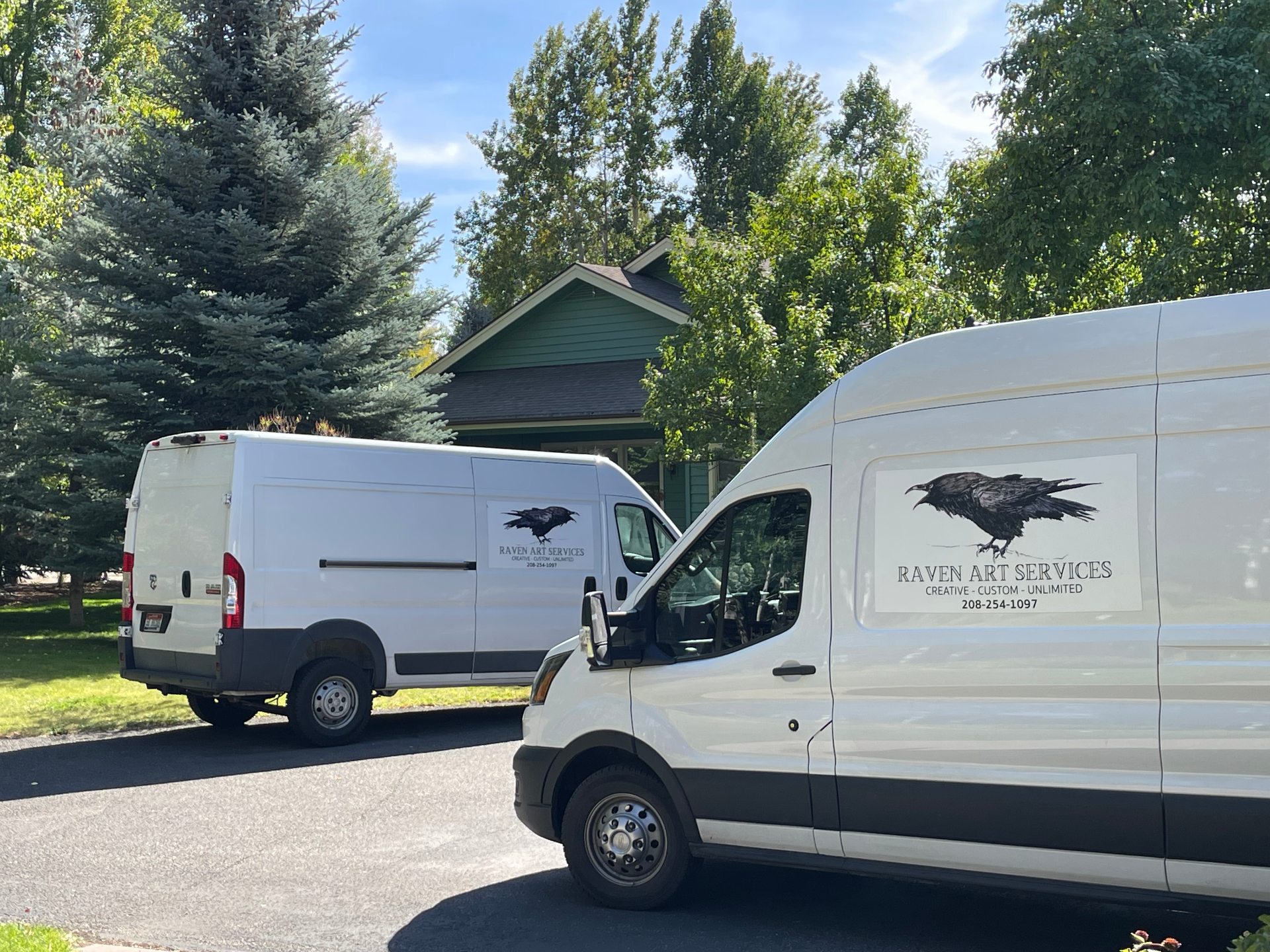 Raven Art Services vans parked at a Wood River Valley home for an art installation